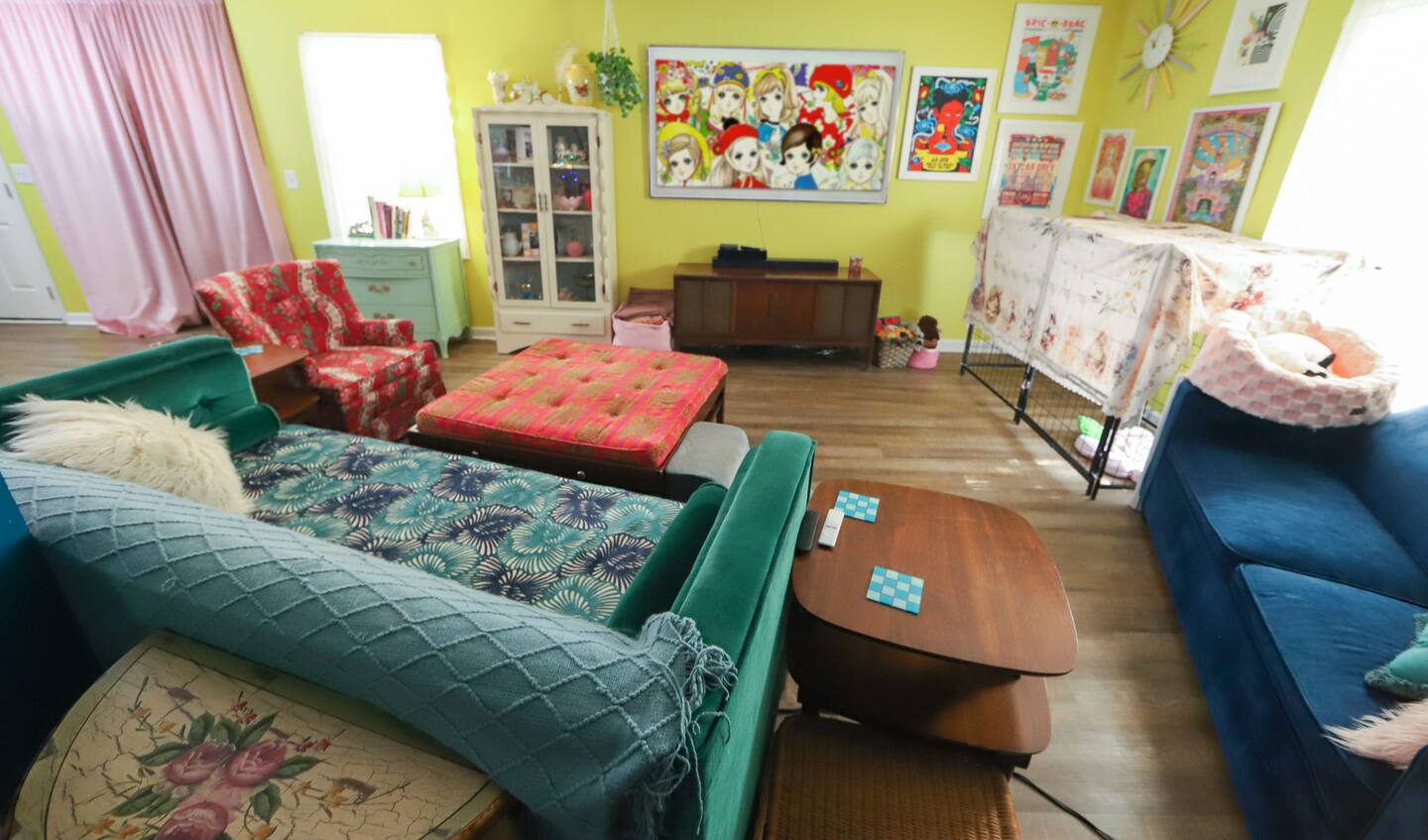 Colorful living area with green sectional